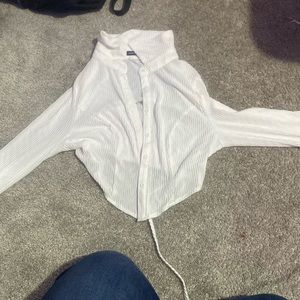 Meant to be styled over some kind of crop top, never worn